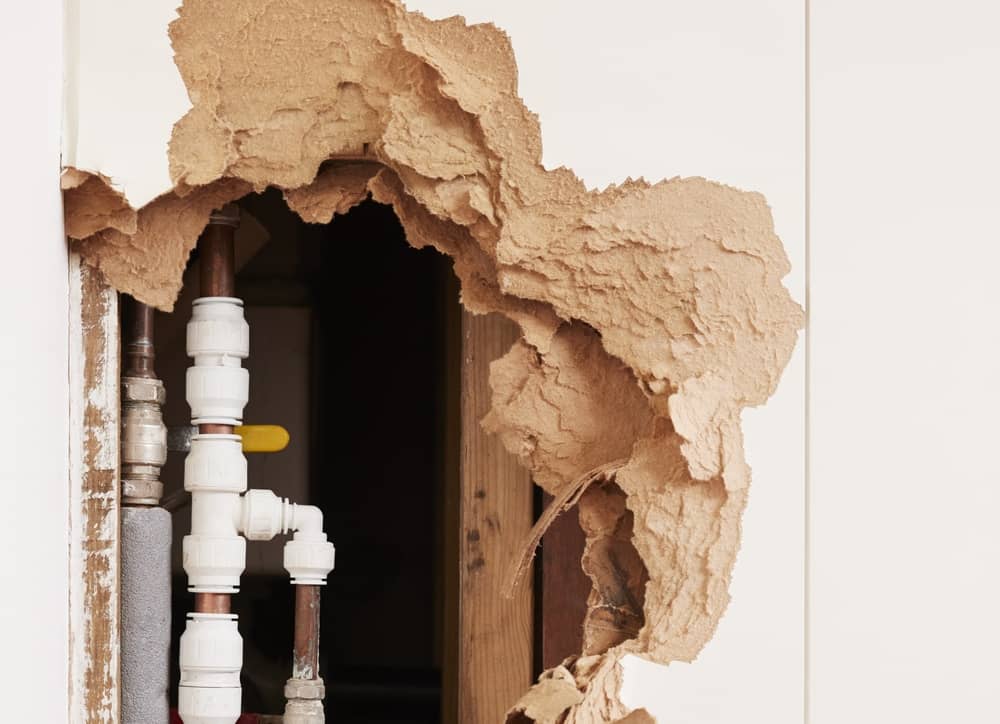 burst pipe damaged wall